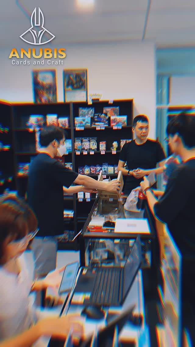 Players lining up at the counter on pre-release day